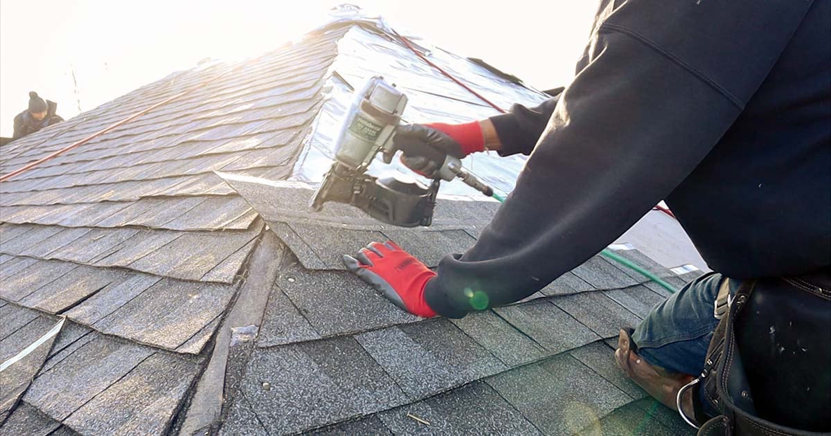 roofer installing gaf shingles